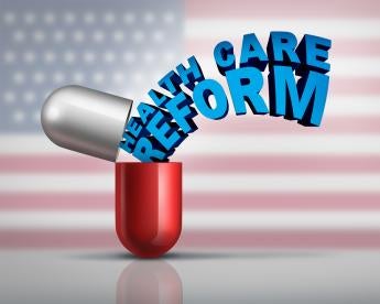 a large red and white capsule releasing the words Healthcare Reform in blue against a US Flag