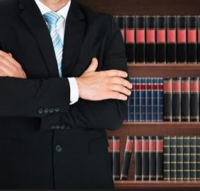 lawyer with books, insurance code, violations