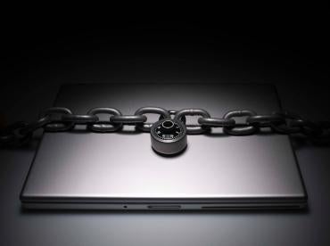 locked laptop, cybersecurity in finance,