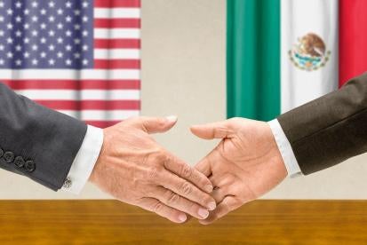 mexico and us flags with handshake 