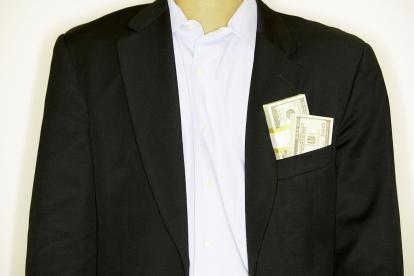 man in suit with money, compliance officers
