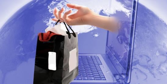 online shopping graphic showing an arm holding a shopping bag extending from laptop screen hovering over a globe