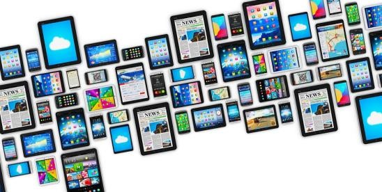 an array of many smartphones, tablets, devices of various brands Apple, Samsung and more