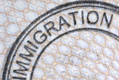 an immigration services stamp on a passport