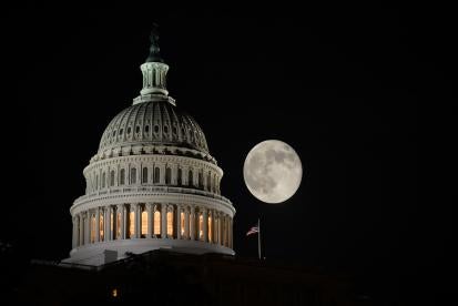 US Capitol building under the falling moon